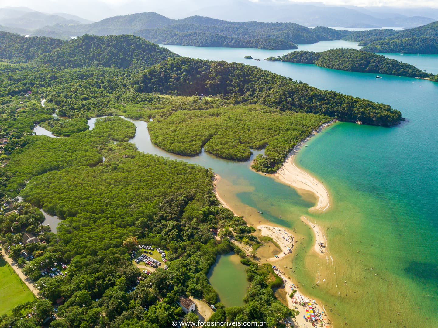 Paraty coastline with forested mountains meeting the warm bay